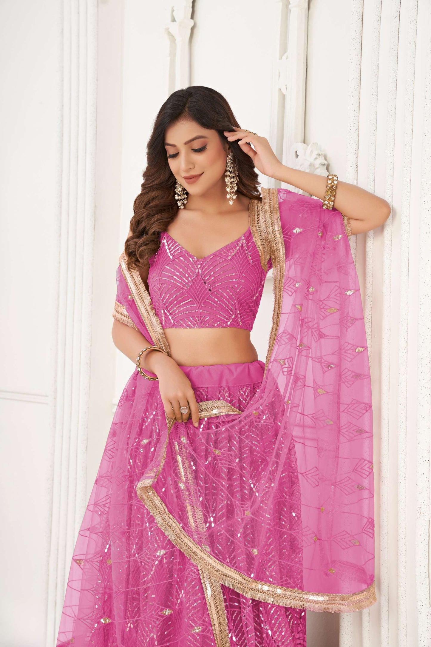 Salmon Pink Sequin Embellished Lehenga Choli in Net