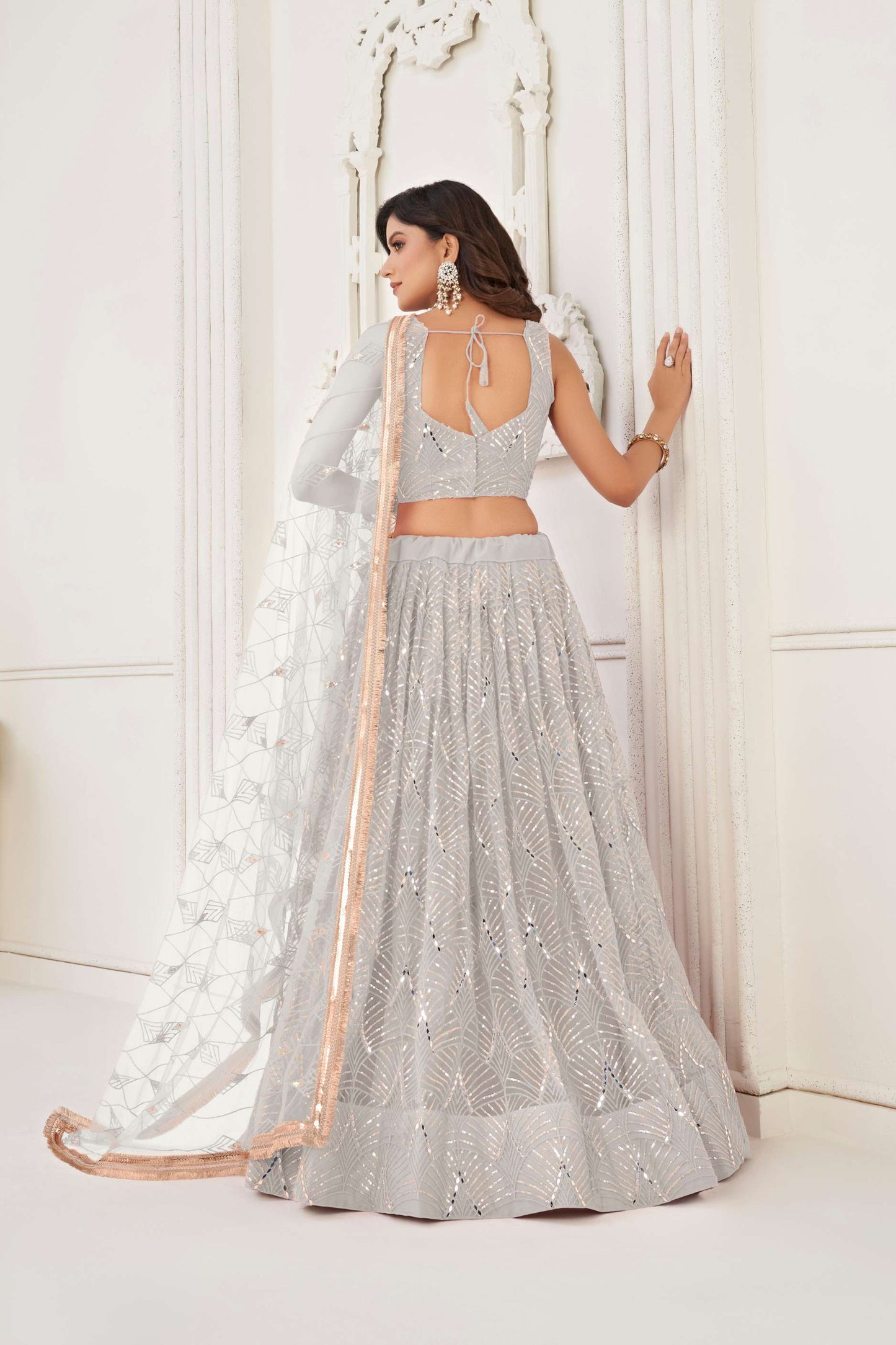 Off White Net Lehenga Choli In Sequins Work