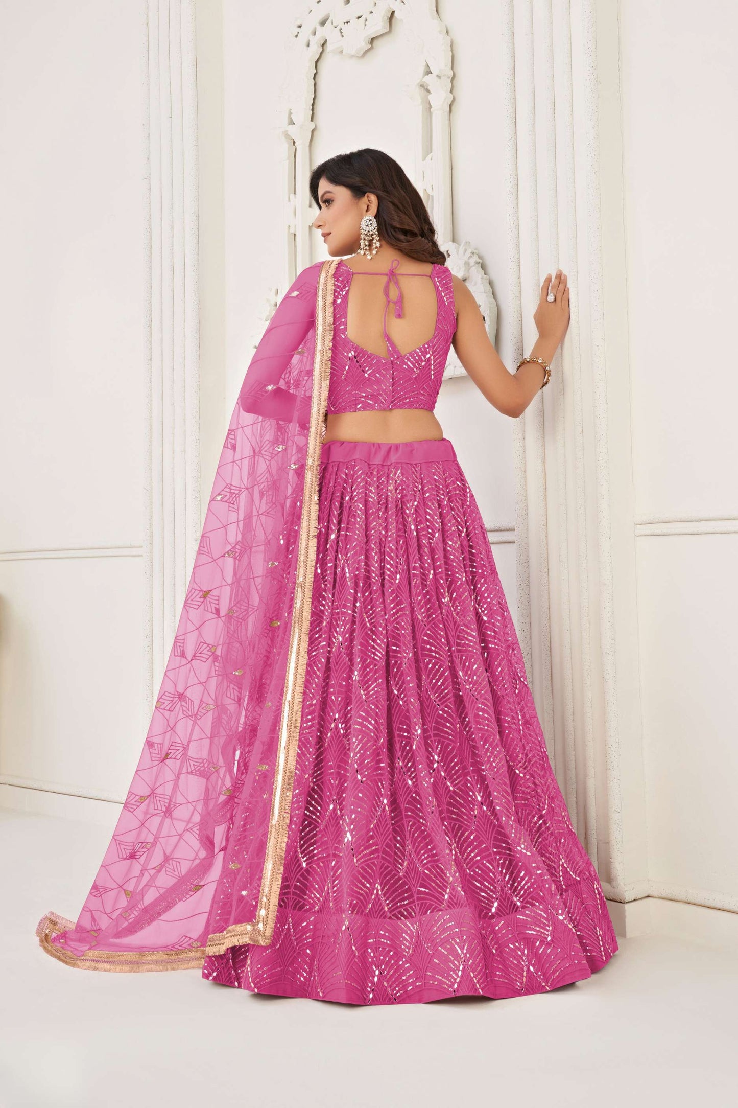 Salmon Pink Sequin Embellished Lehenga Choli in Net