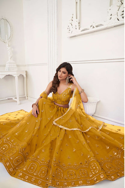 Yellow Embroidered Lehenga Choli in Net
