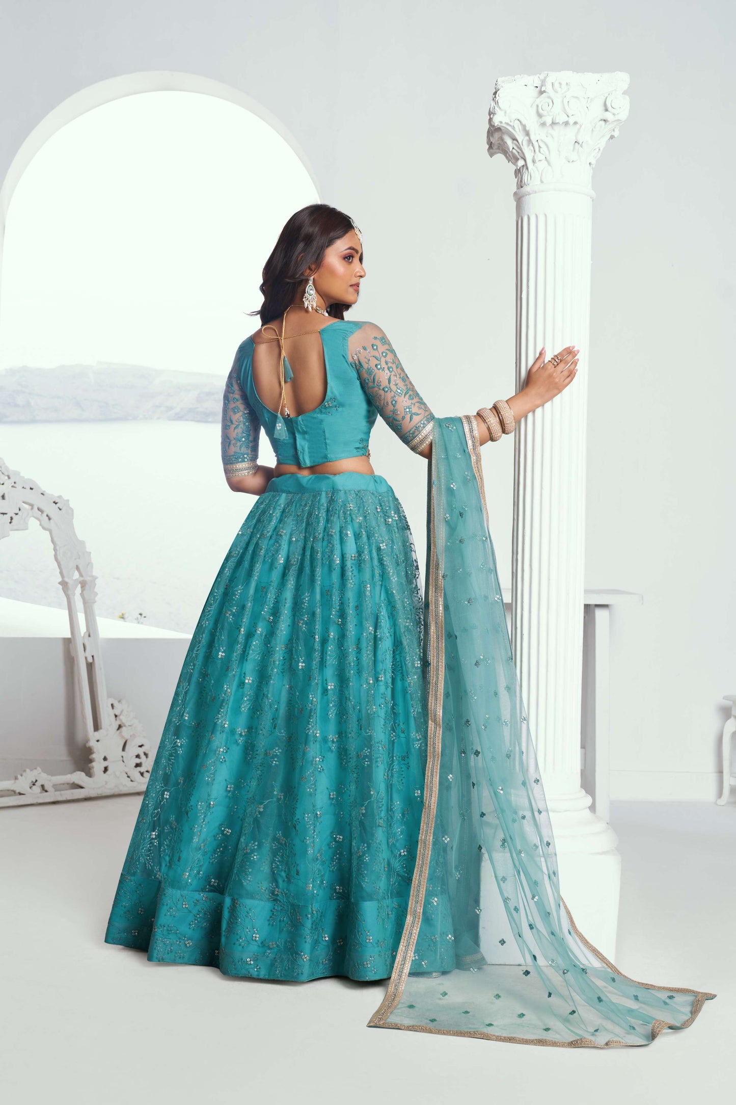 Turquoise Embroidered Net Lehenga Choli