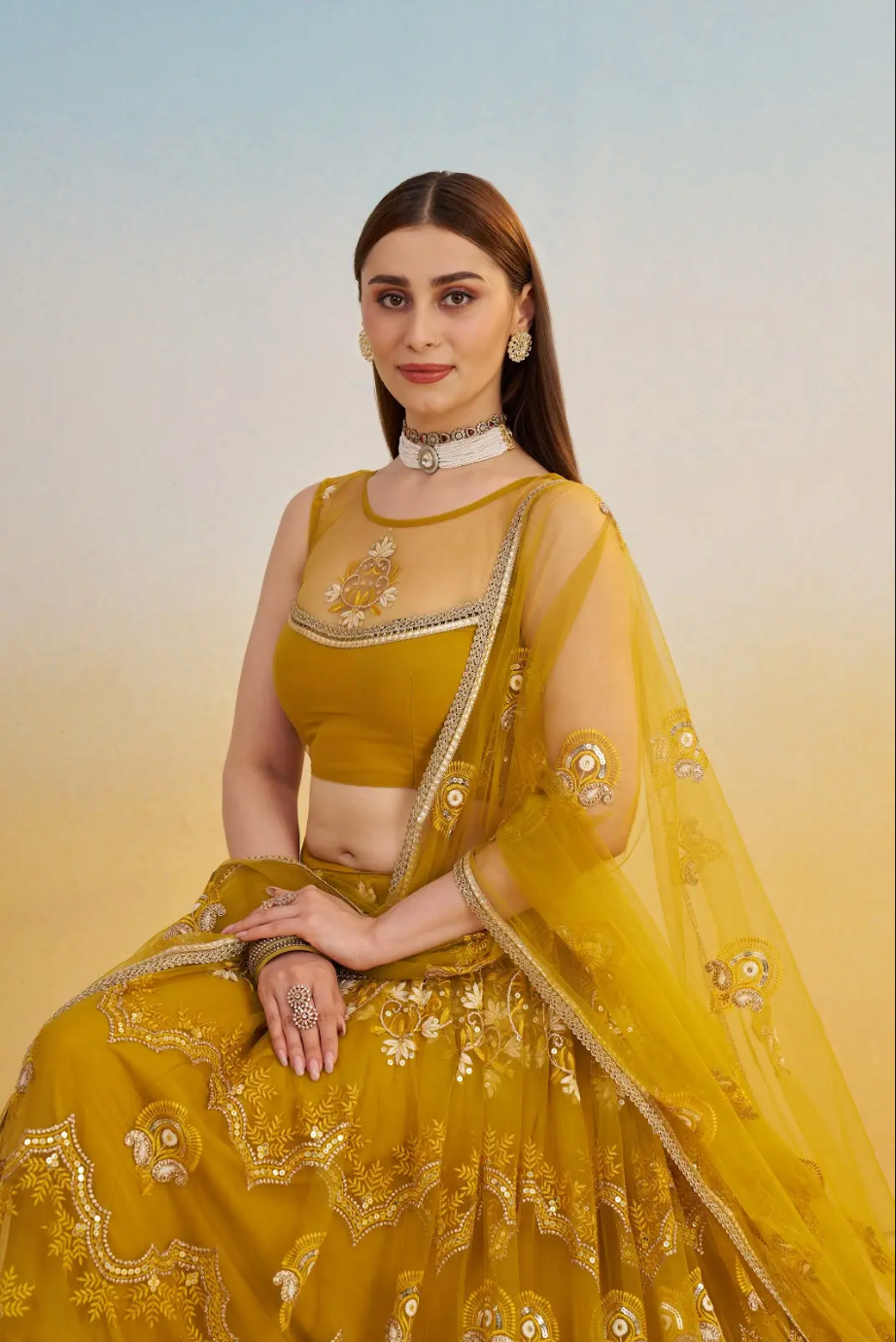 Yellow Net Lehenga Choli in Sequins Embroidery